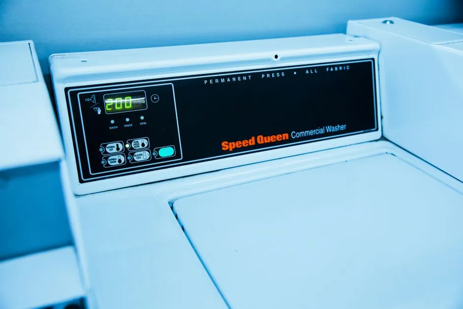 Close-up of a commercial washing machine control panel display